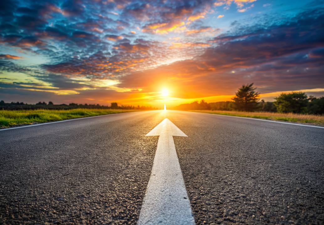 Generated with AI: white arrow on a road at sunset